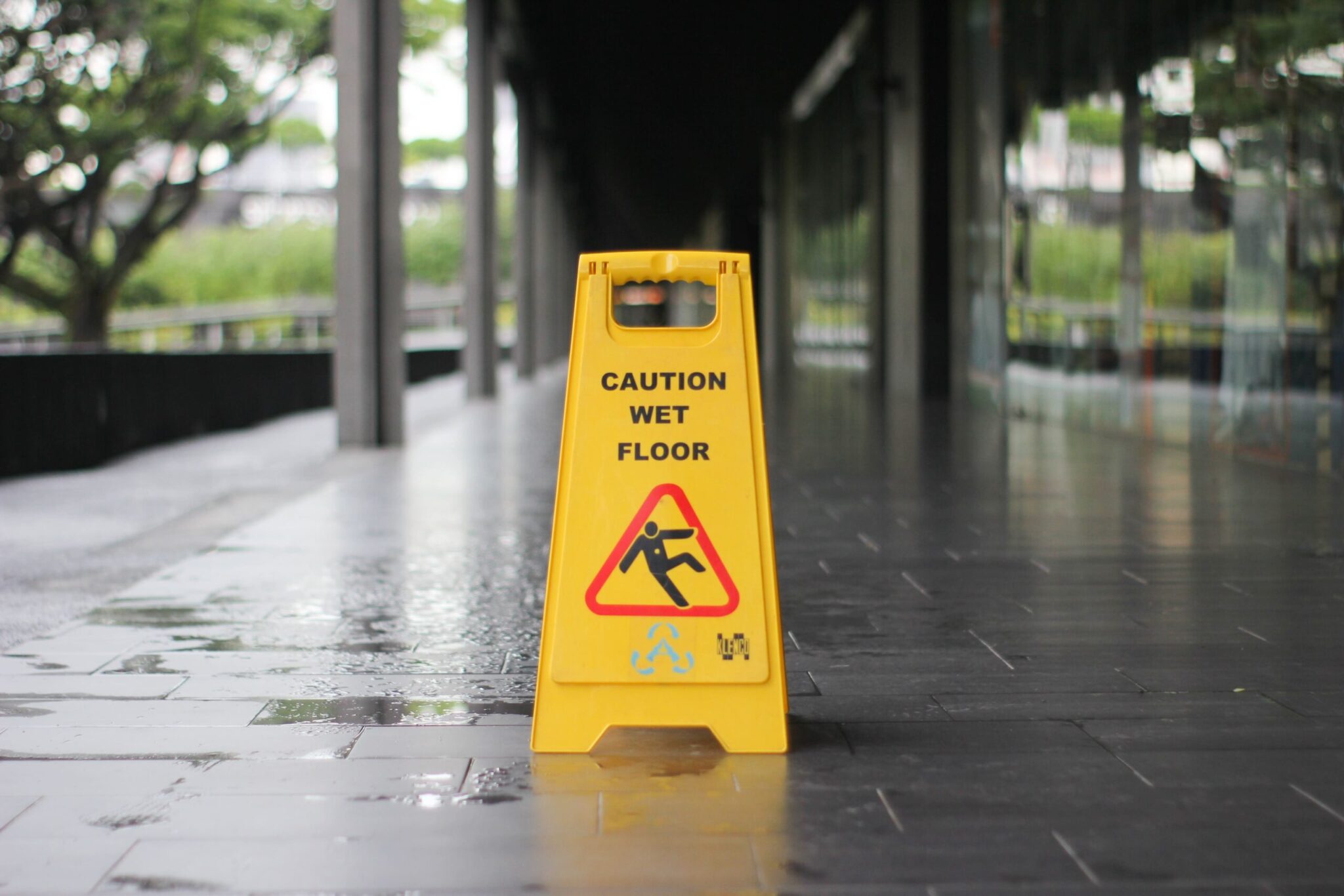 slip and fall injury wet floor sign lawyers